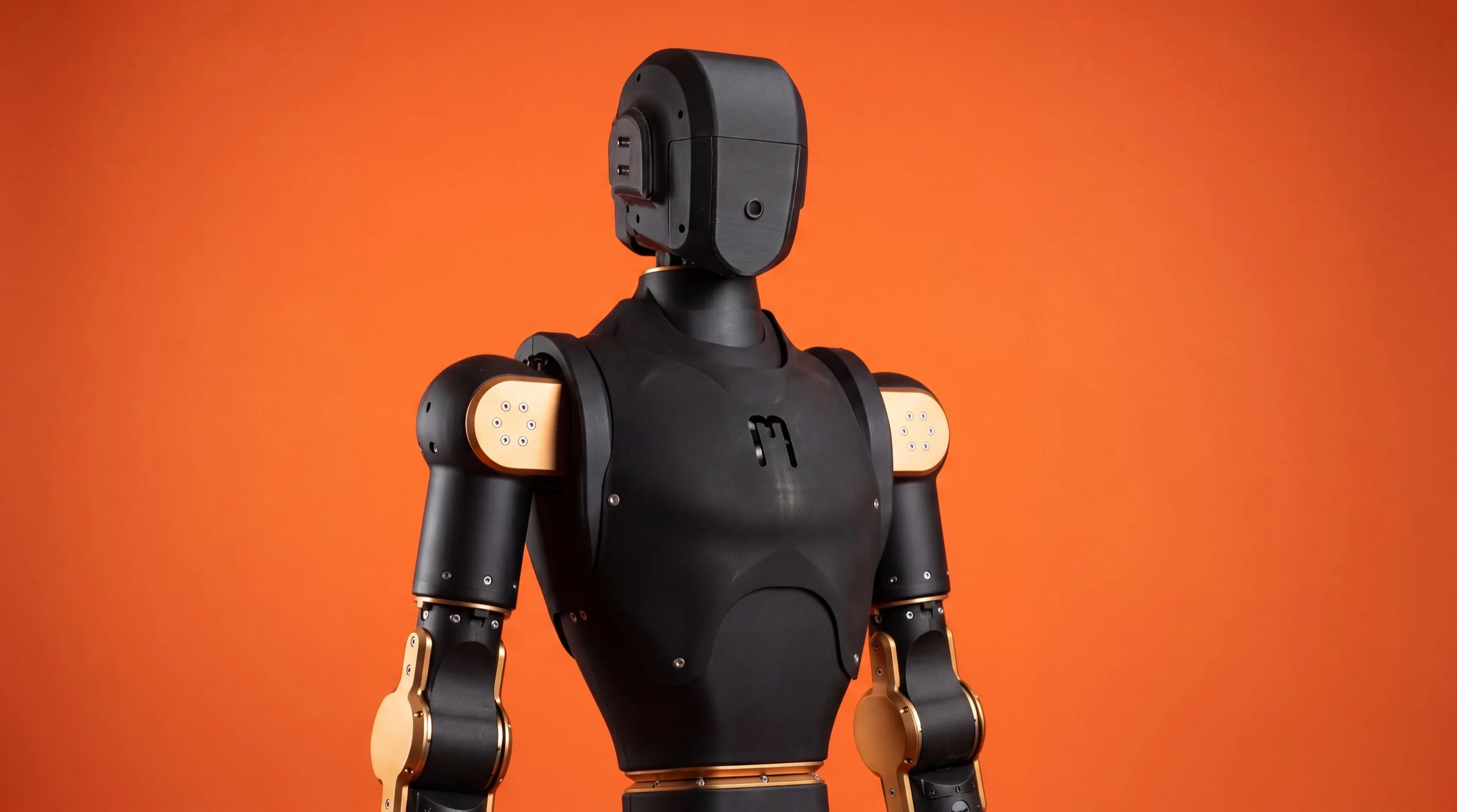 Asimov 1 black humanoid torso and head with gold joint accents on orange background