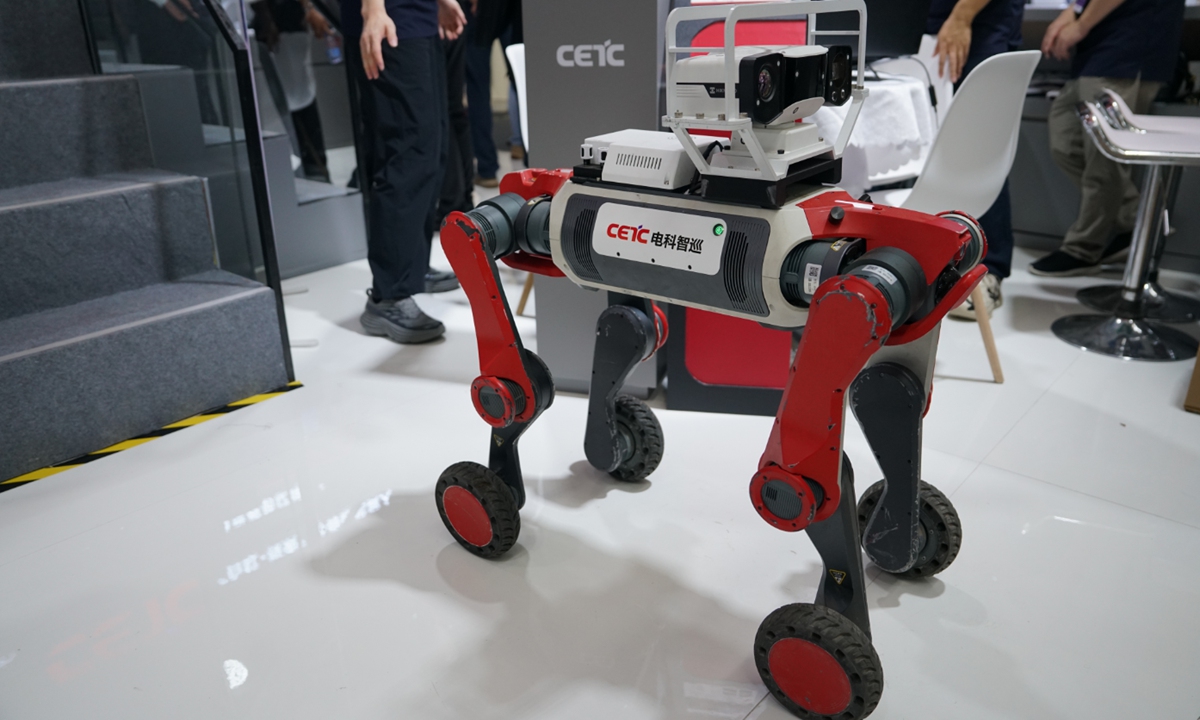 CETC wheeled-leg robotic dog with a camera mast at WRC 2026