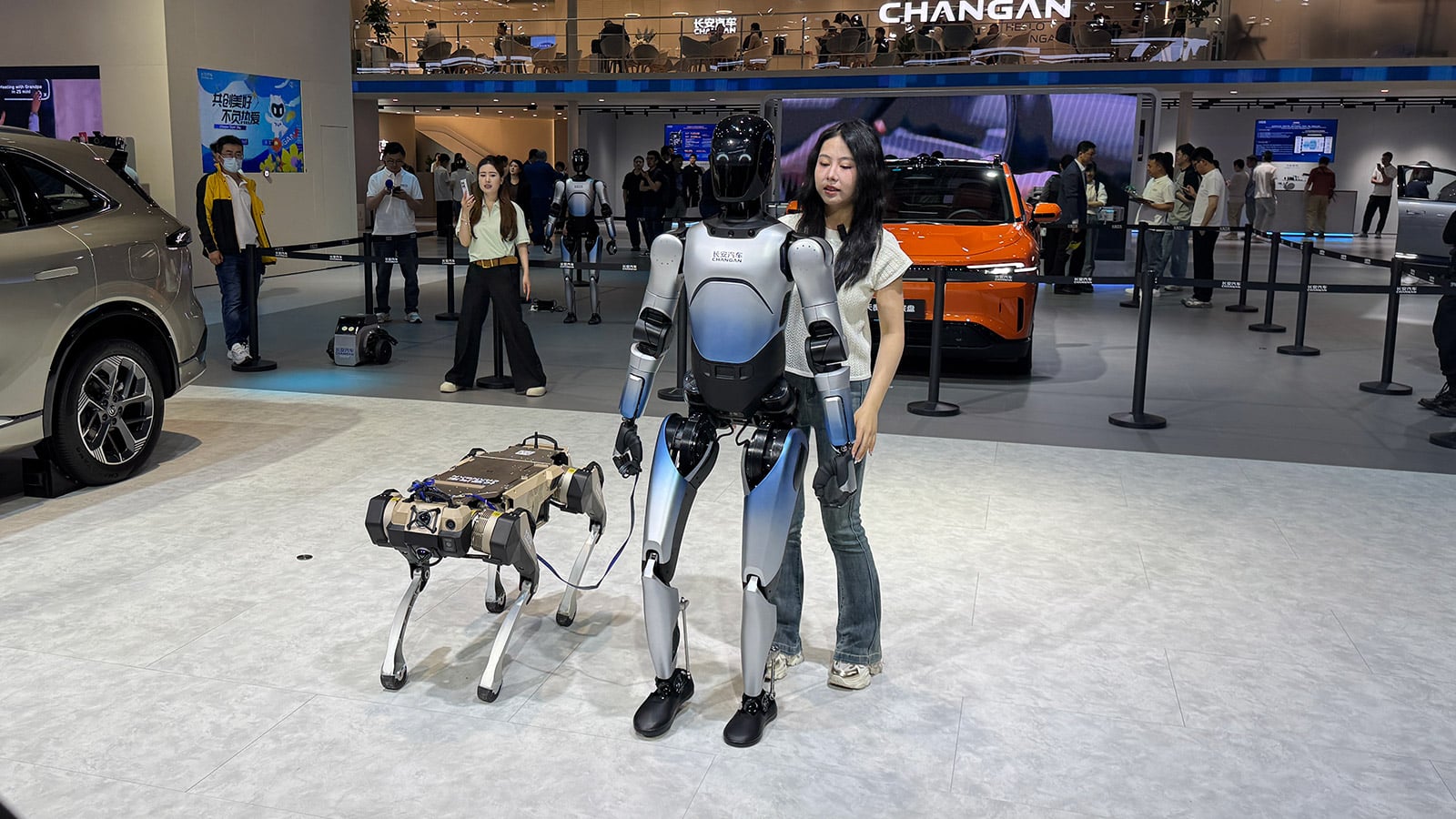 Humanoid robot and robot dog display used in CnEVPost coverage