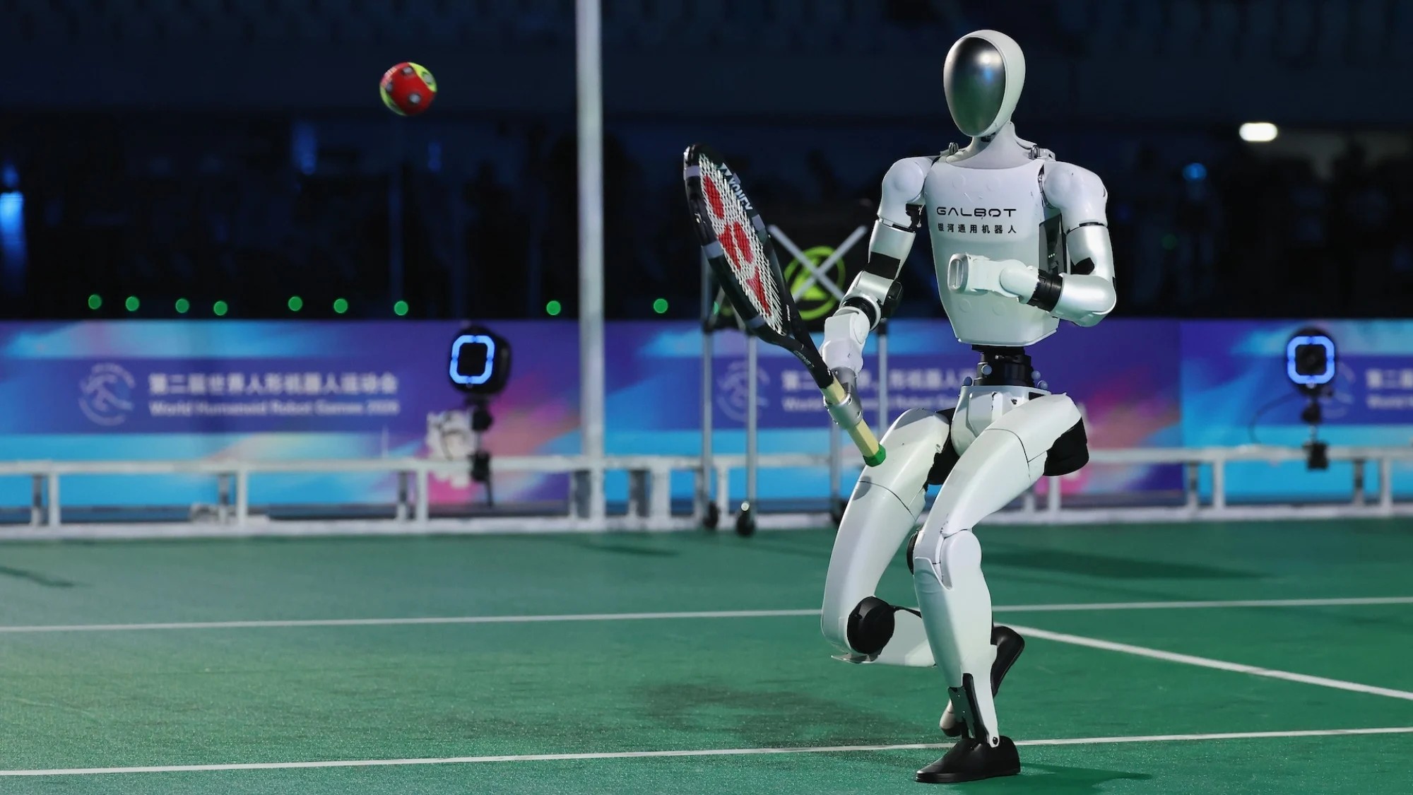 Galbot ET1 humanoid swinging a tennis racket on an indoor court
