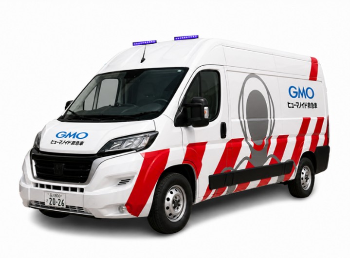 White GMO Humanoid Ambulance van with red chevrons and roof lights