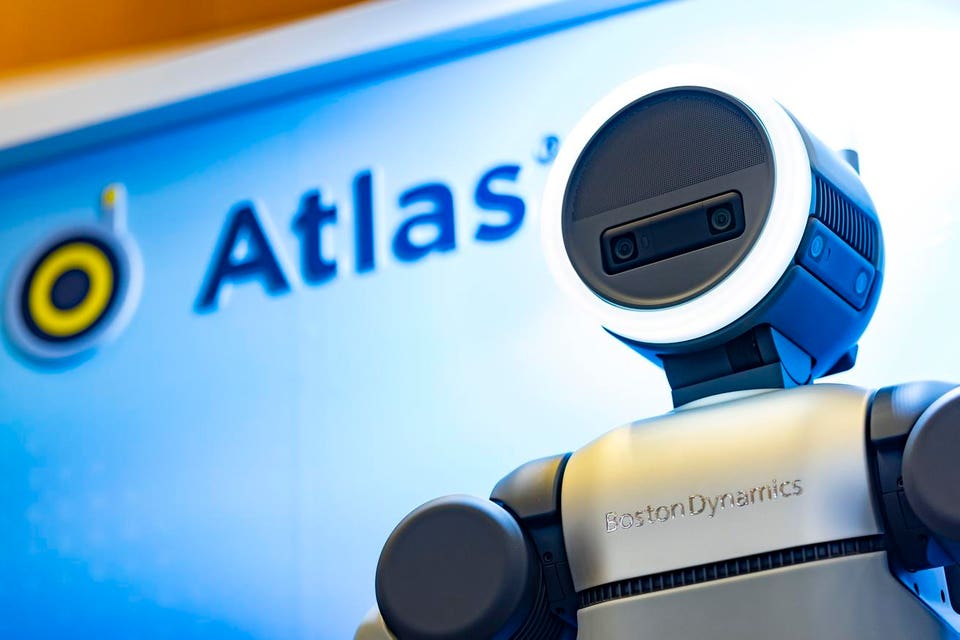 Close-up of Boston Dynamics Atlas head with Atlas branding behind