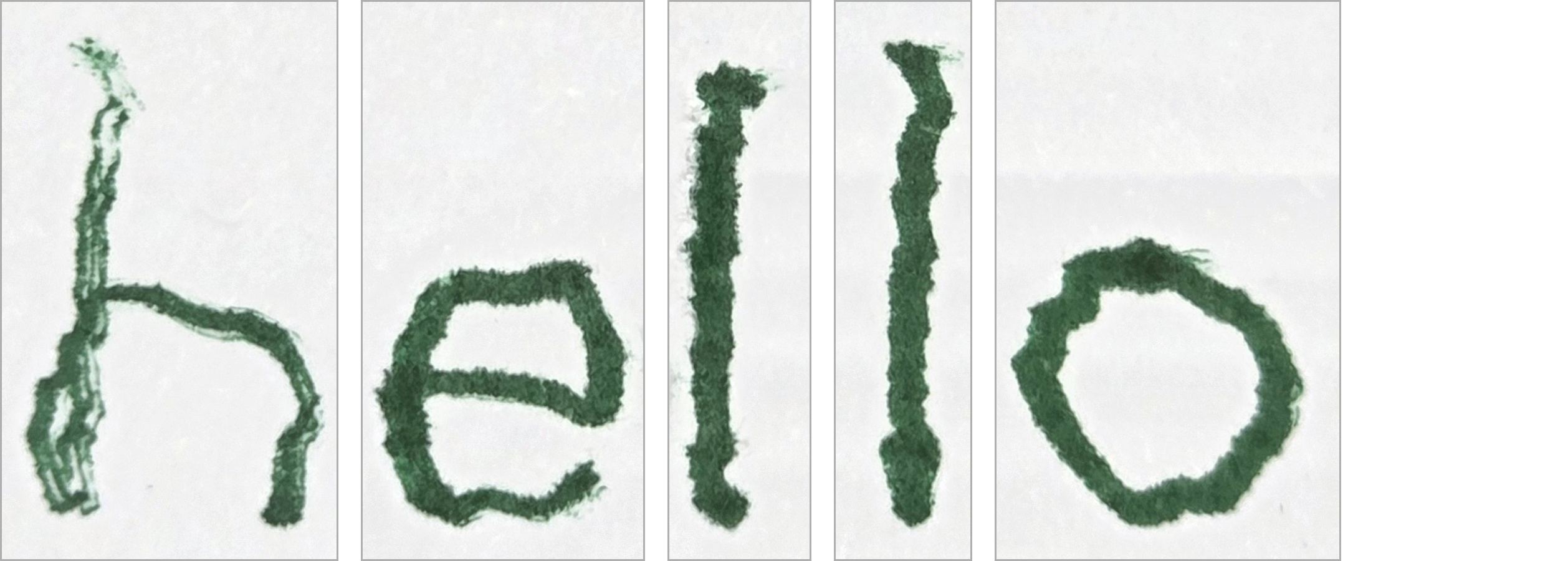 Green ink letters h e l l o written by the ORCA hand