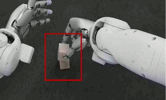 Two white robot hands stacking wooden blocks, with a red box around the stack