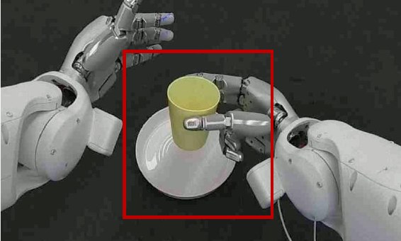 Robot gripper placing a cup onto a plate in the calibrated tabletop cell