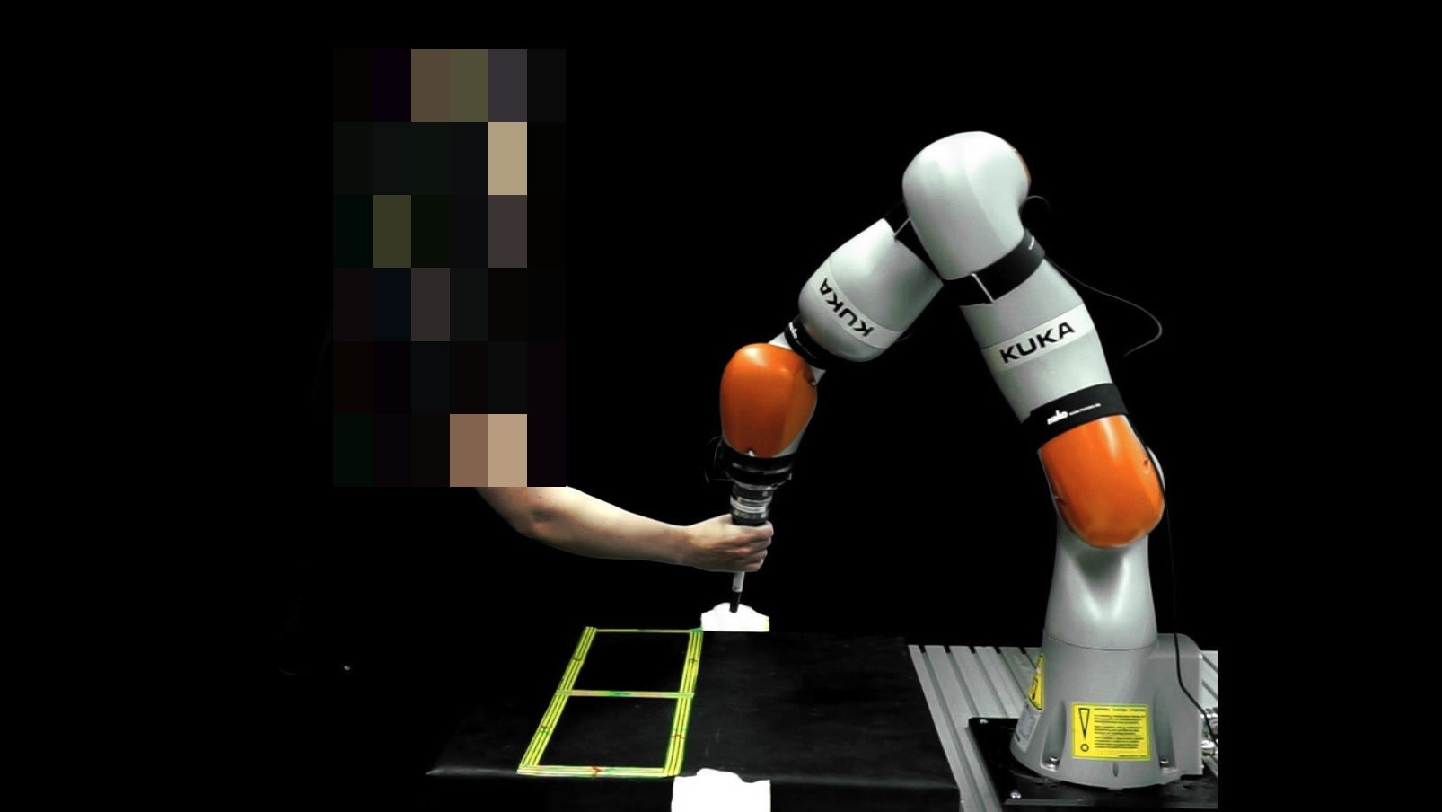 KUKA LWR iiwa in the agility test, operator tapping boxes on a metronome