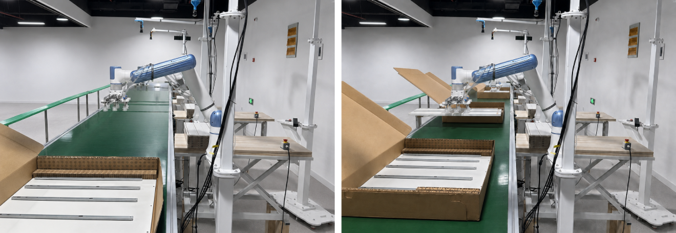 Blue industrial arm packing boards into a cardboard box on a green conveyor