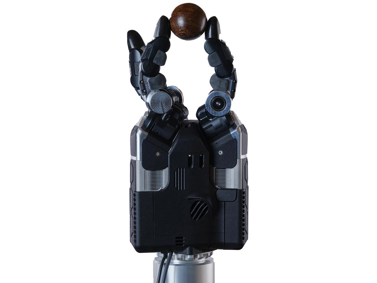 Shadow Robot DEX-EE three-finger hand pinching a ball