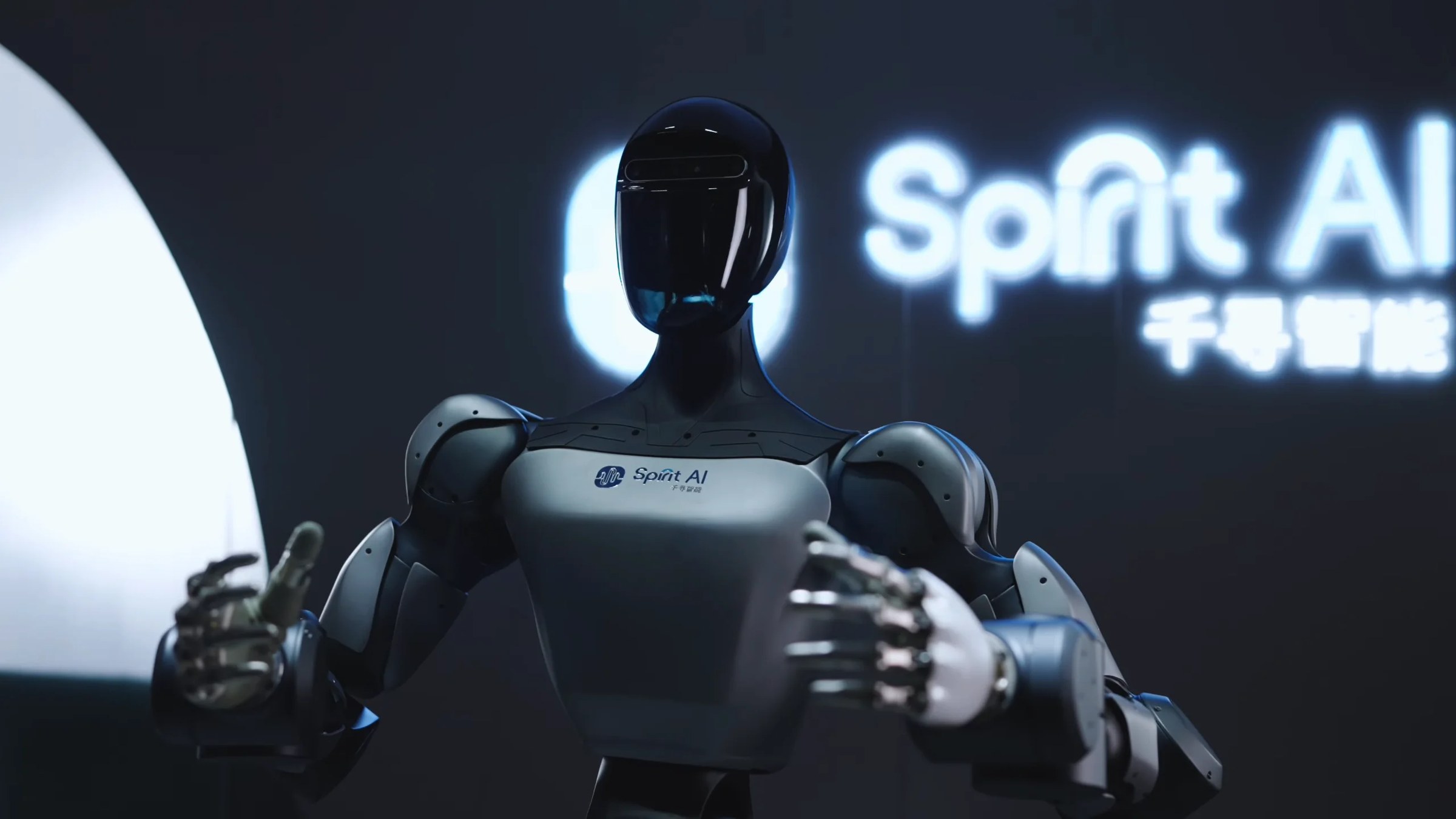 Spirit AI humanoid on stage in front of the company logo