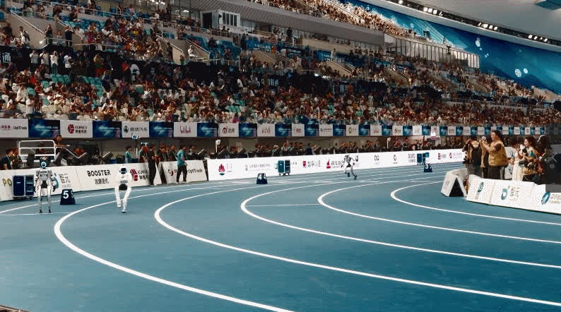 Humanoid robots on the blue indoor track at Beijing’s National Speed Skating Oval