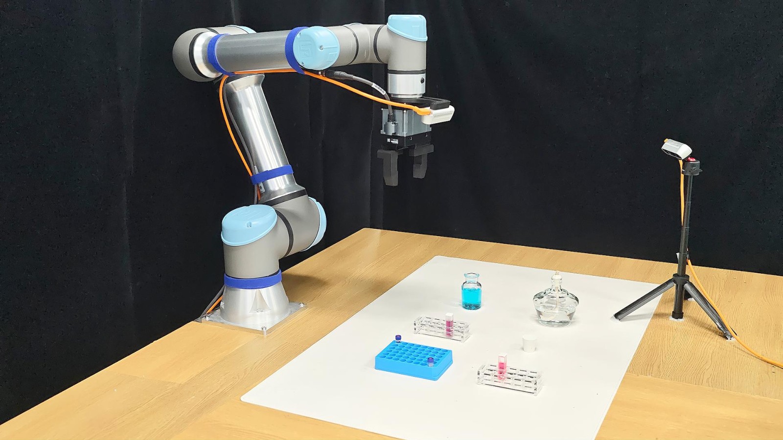 UR5e with a parallel gripper at a chemistry bench
