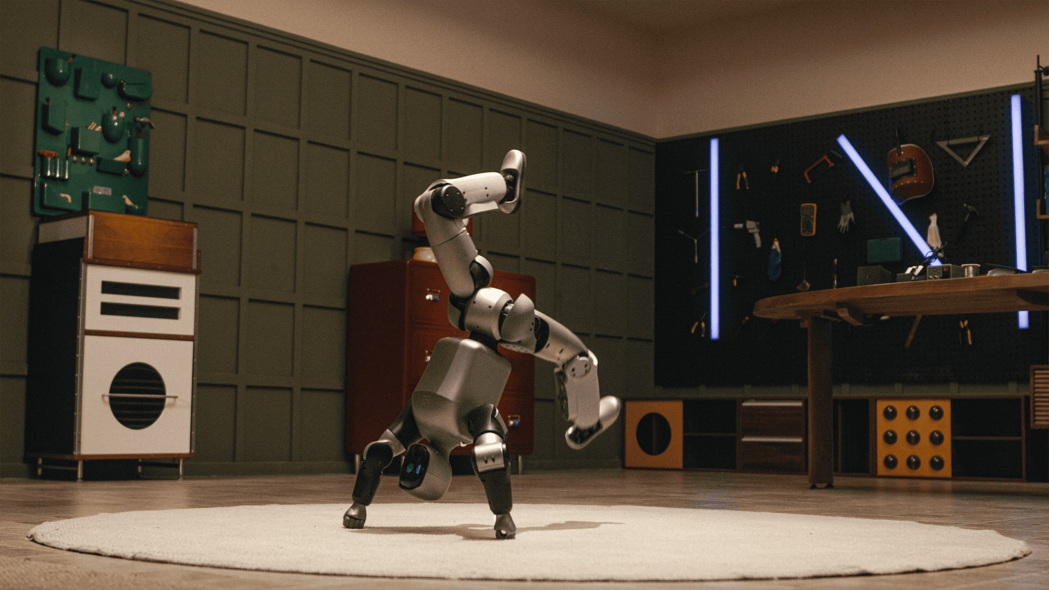 Silver Bridge humanoid doing a one-handed freeze in a workshop